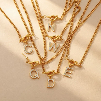 Zircon Initial Love Knot Necklace